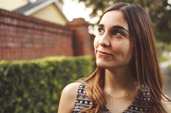 Young woman looking optimistically into the distance