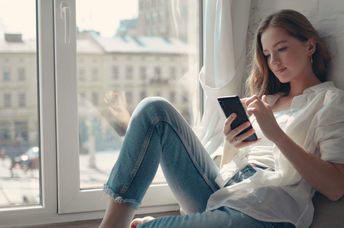 Young woman using a mental health app.