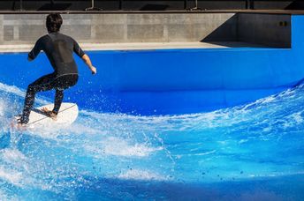 Surfing in an urban wave pool.