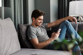 A man looks at his phone.