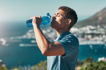 A man drinks water.