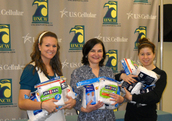 Theresa Tese (center) at a UNCW (University fo North Carolina - Wilmington) basketball 'sock tickets' event