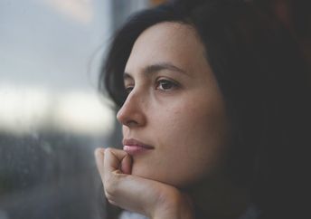 A woman deep in thought