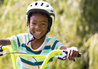 Kid riding a bike.