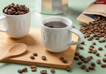 Espresso coffee and coffee beans.