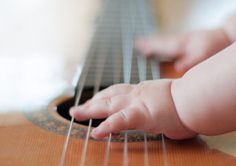 Playing the guitar.