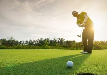 Man playin golf.