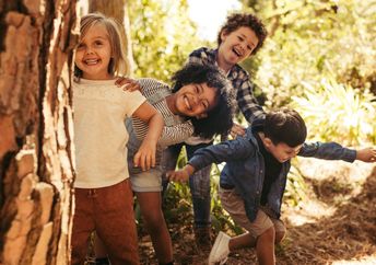 Children playing outside in nature.
