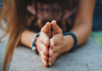 Spiritual woman expressing gratitude,