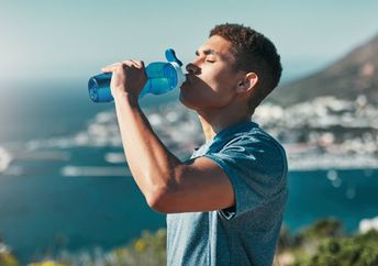 A man drinks water.