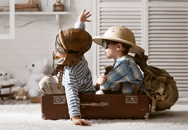 Boys pretending to travel by plane.
