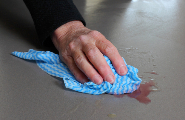 Cleaning up a liquid spill on a kitchen counter Cleaning up a liquid spill on a kitchen counter