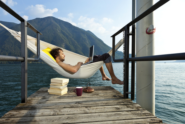 Man on hammock with laptop Man on hammock with laptop
