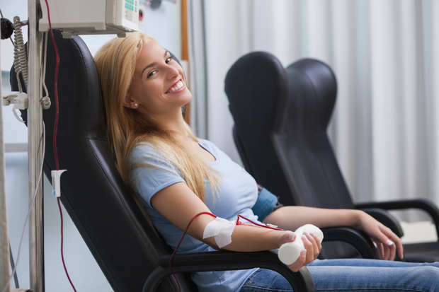 Woman donating blood. Woman donating blood.