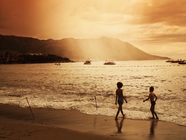Happy healthy children playing on the beach Happy healthy children playing on the beach