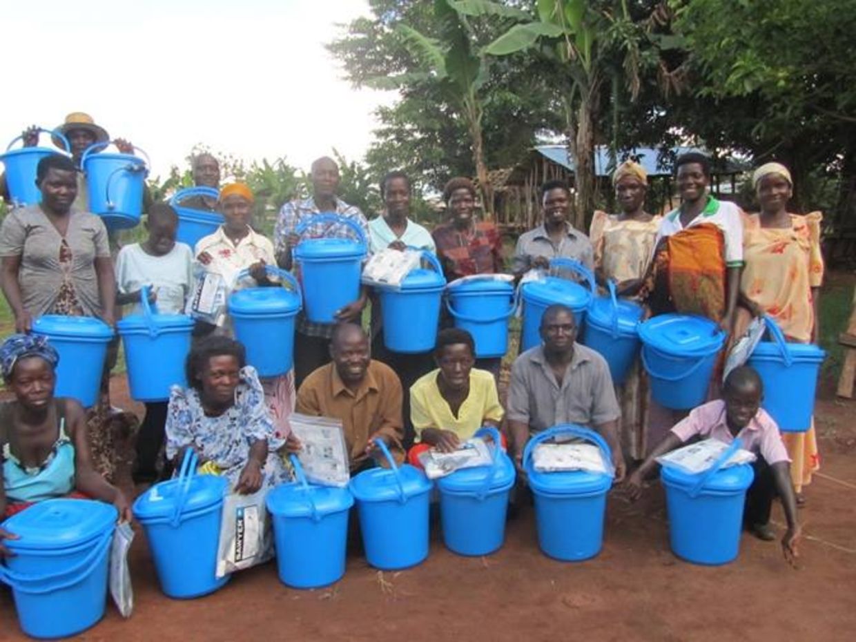 Ugandans holding water filtration packets Ugandans holding water filtration packets