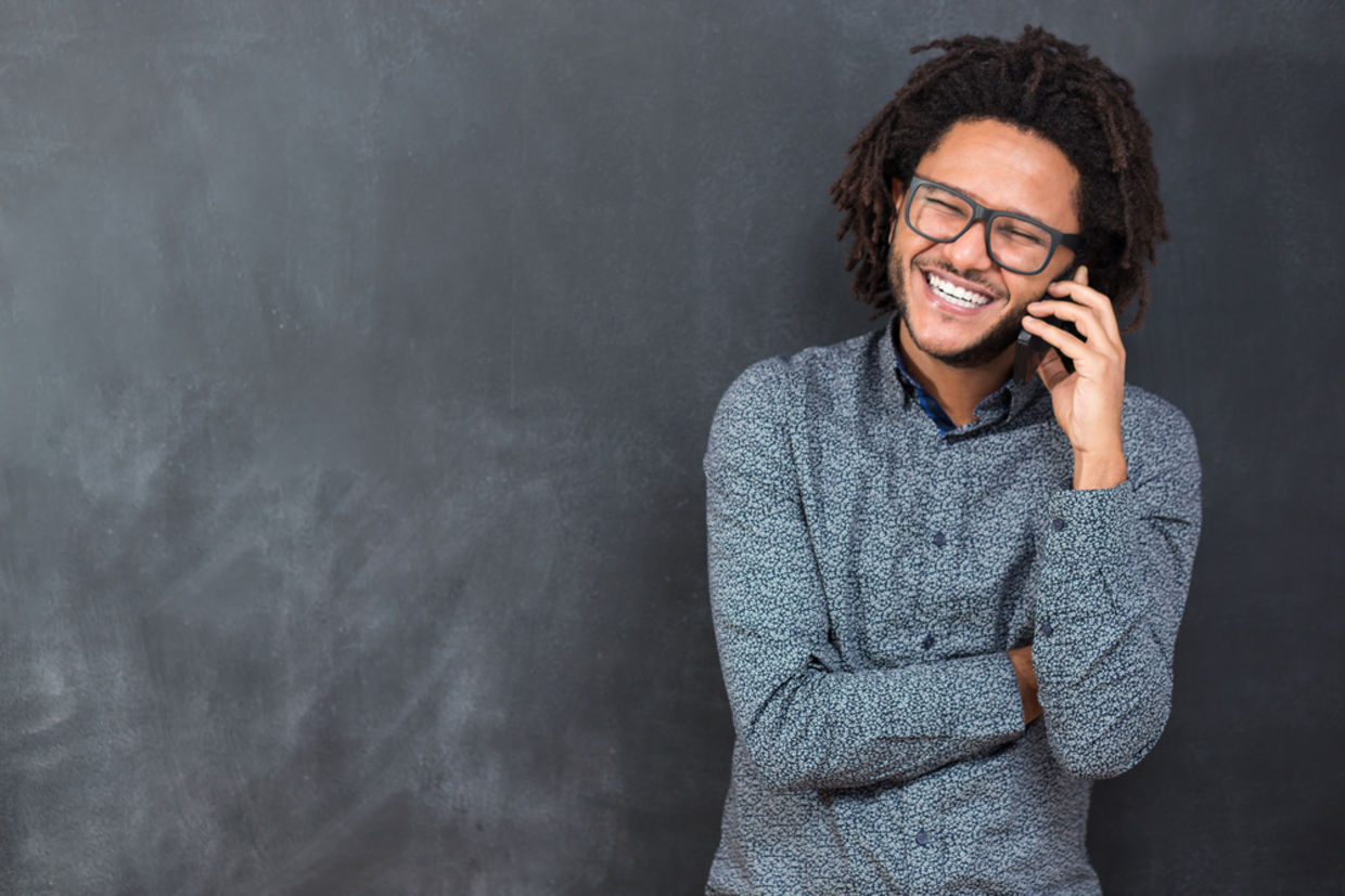 Happy man talking on the phone Happy man talking on the phone