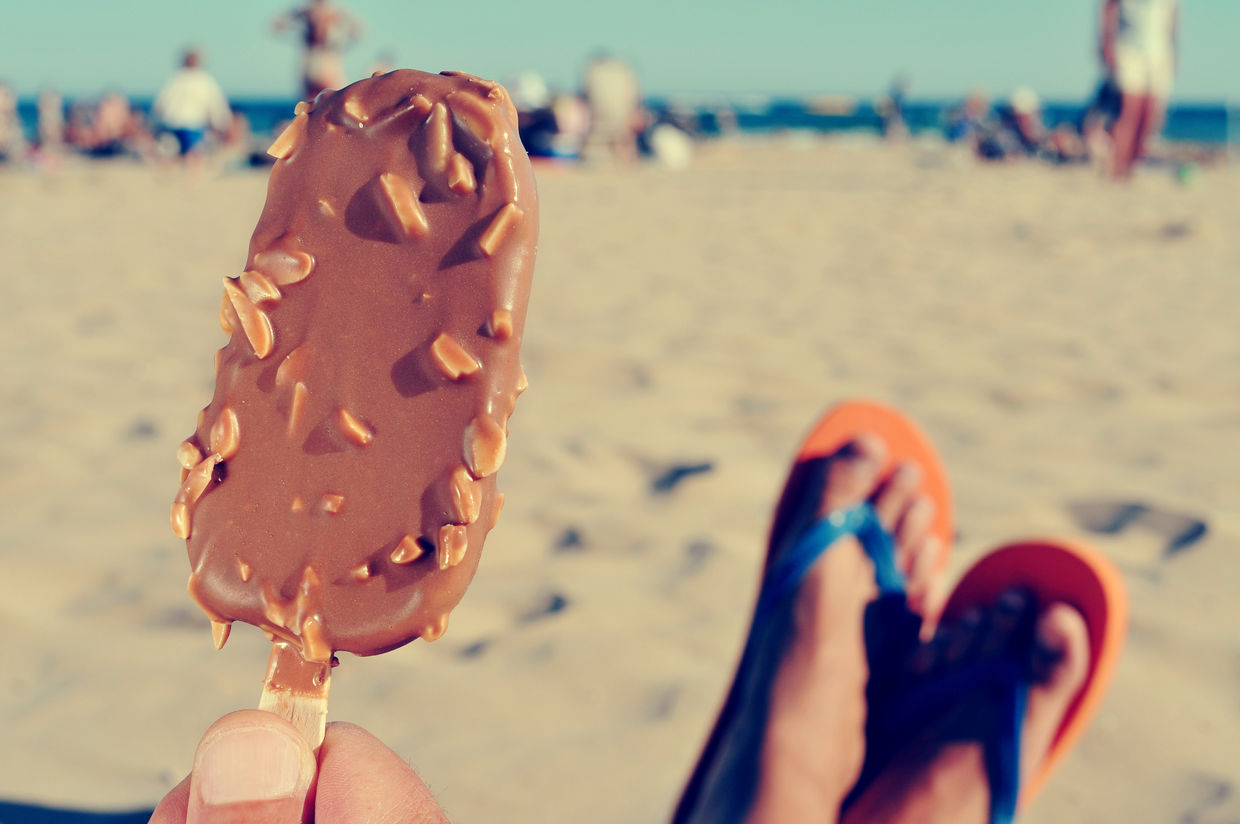 Eating a chocolate ice cream on the beach Eating a chocolate ice cream on the beach