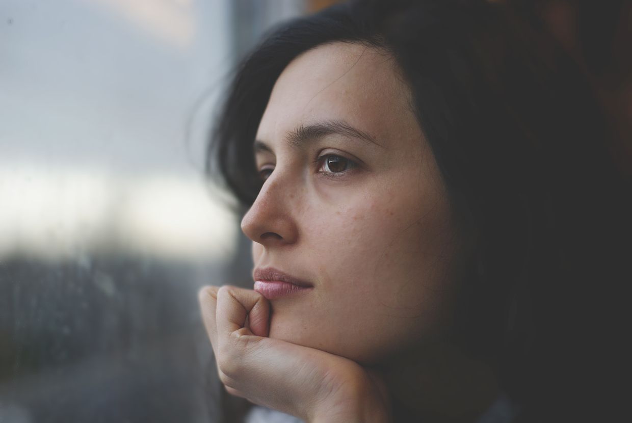 A woman deep in thought