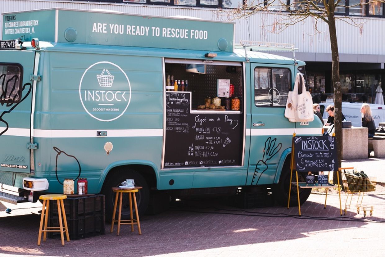 A food truck of the instock restaurant stands by the street A food truck of the instock restaurant stands by the street