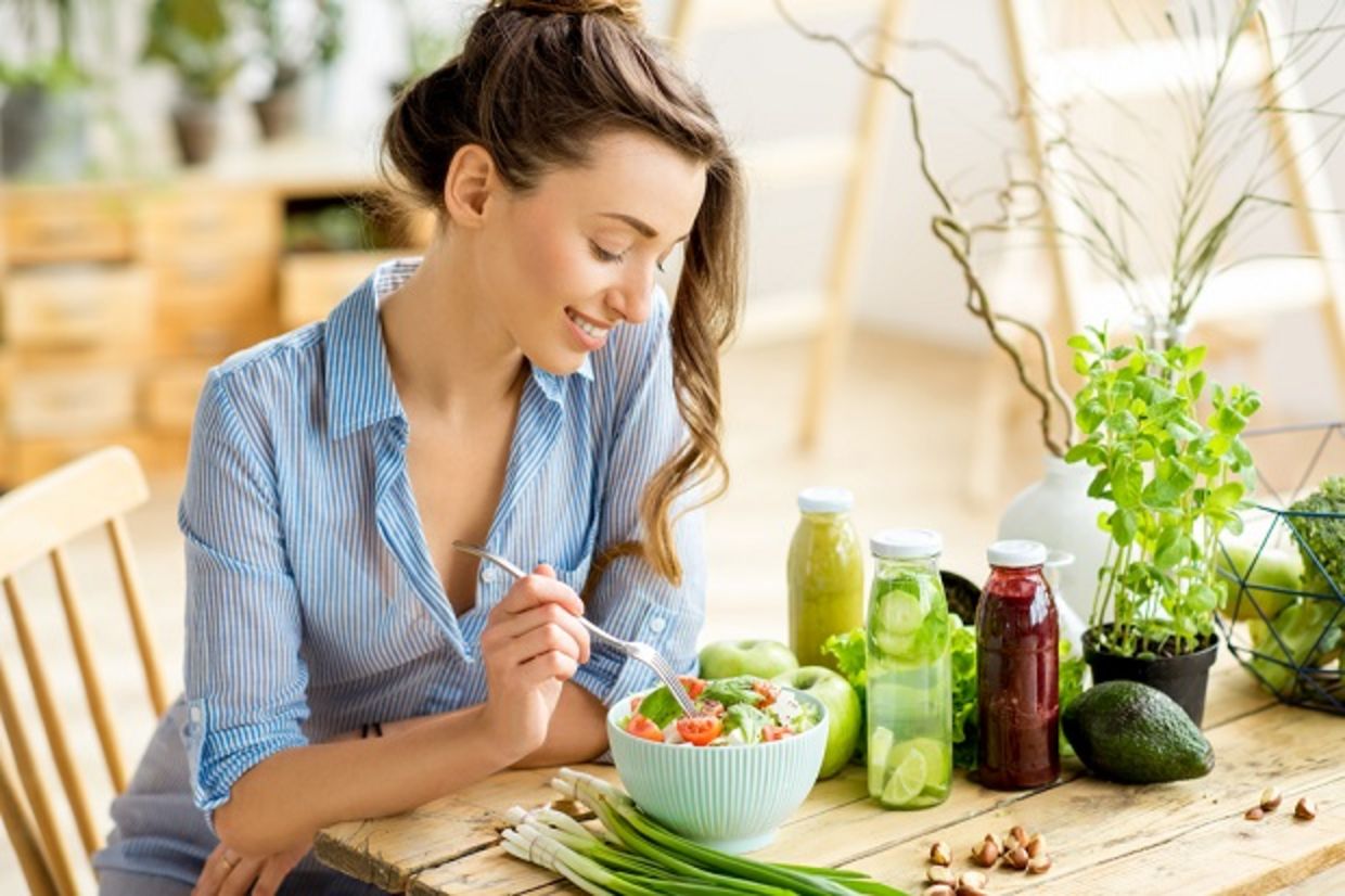Young woman eating a healthy salad Young woman eating a healthy salad