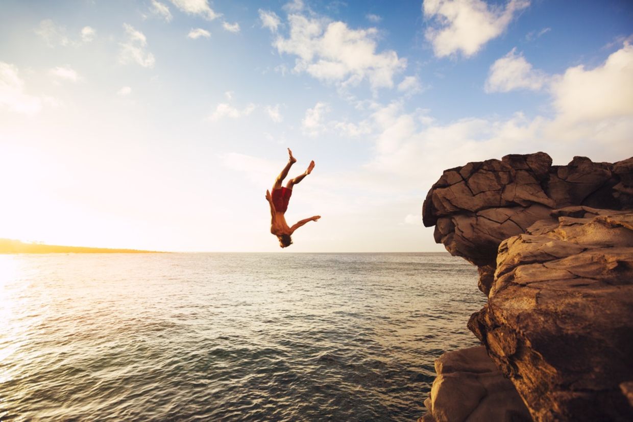 Cliff Jumping into the Ocean at Sunset Cliff Jumping into the Ocean at Sunset