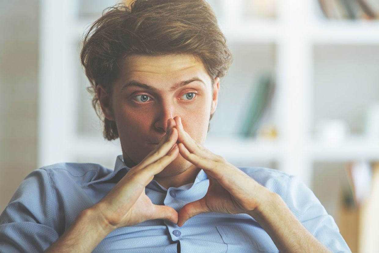 Portrait of worried young man at workplace. Portrait of worried young man at workplace.
