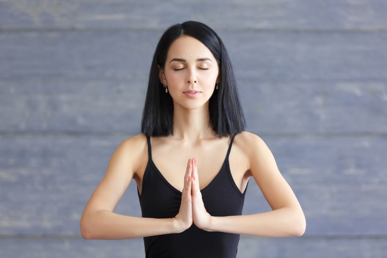 Portrait of smiling brunette young woman enjoying yoga. Portrait of smiling brunette young woman enjoying yoga.