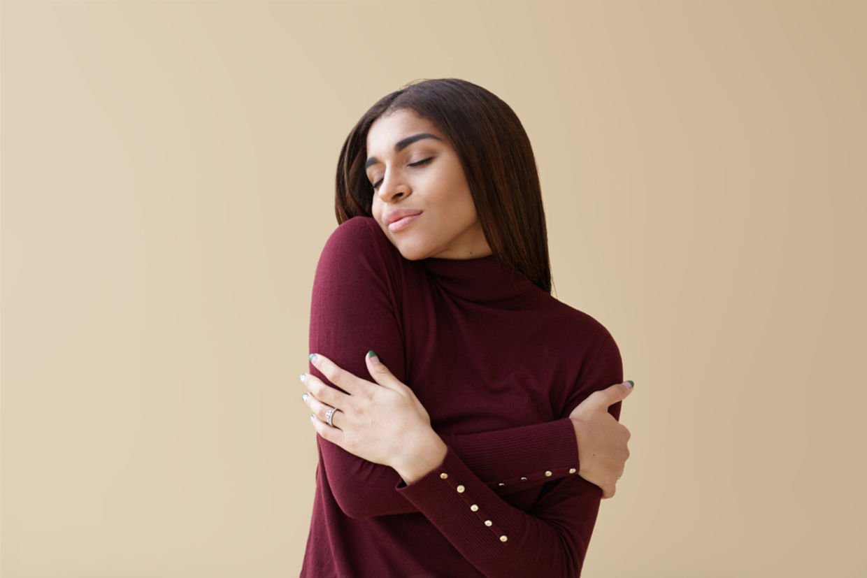 A woman hugging herself