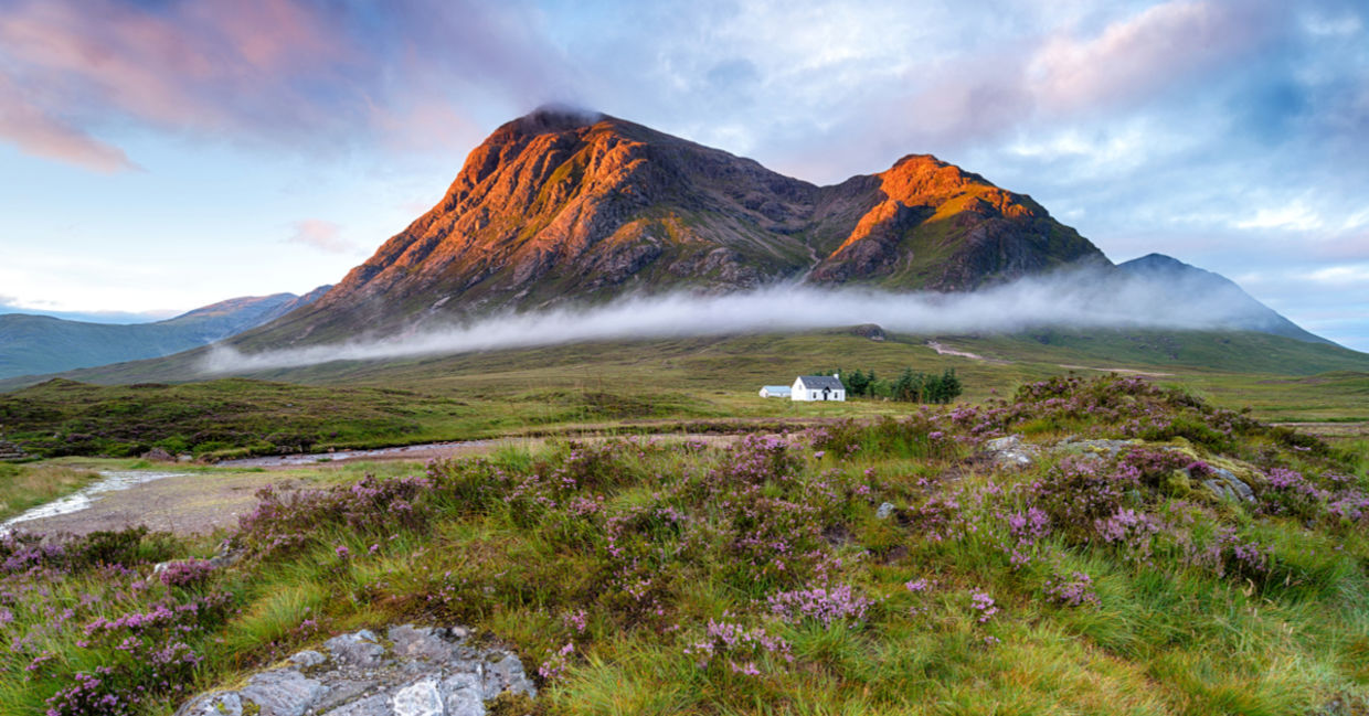 Sunrise over the mountain tops at Glencoe in the highlands of Scotland Sunrise over the mountain tops at Glencoe in the highlands of Scotland