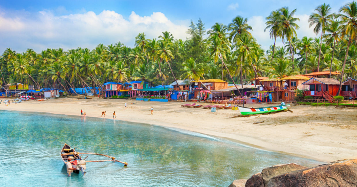 Tropical beach in Goa on a background of palm trees Tropical beach in Goa on a background of palm trees
