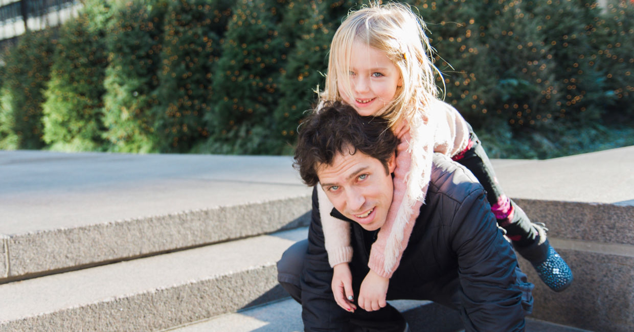 Father and small daughter walk in the park Father and small daughter walk in the park