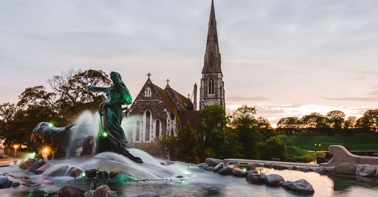 Beautiful sunset St. Alban's church (Den engelske kirke) and fountain in Copenhagen, Denmark Beautiful sunset St. Alban's church (Den engelske kirke) and fountain in Copenhagen, Denmark