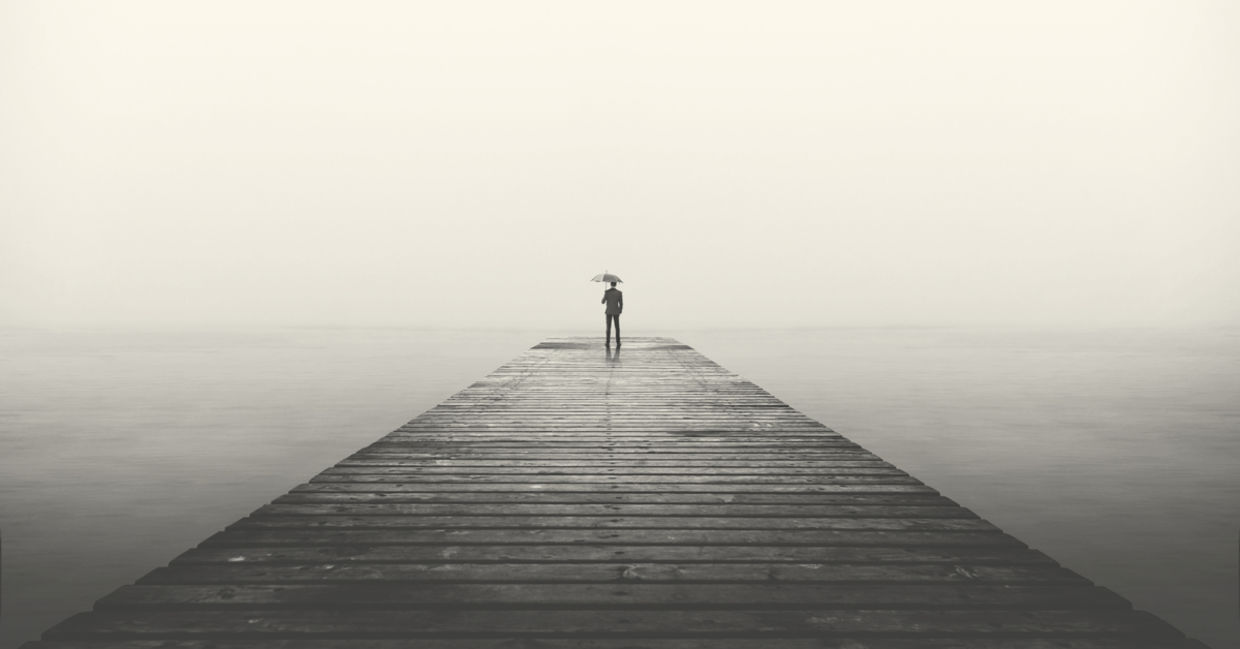 business man with umbrella looking at the horizon business man with umbrella looking at the horizon