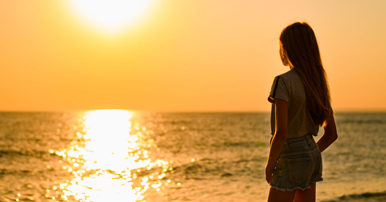 Girl at sunset near water Girl at sunset near water