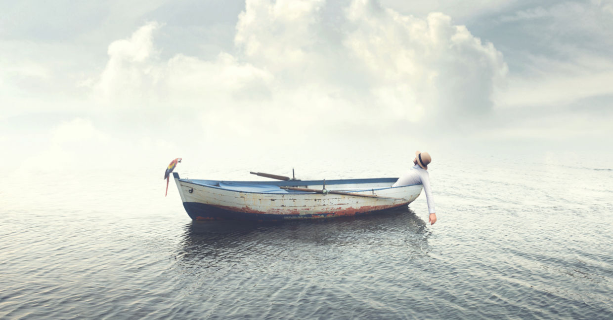 Man on a boat in the sea. Man on a boat in the sea.