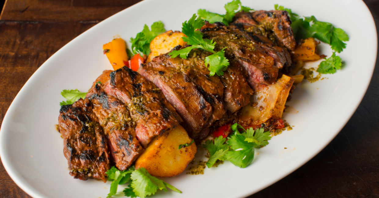 Sous vide skirt steak is served with potatoes. Sous vide skirt steak is served with potatoes.