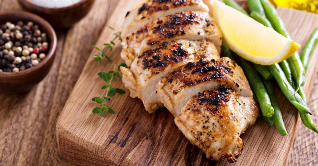 Sous vide chicken breast is served with a wedge of lemon and fresh thyme. Sous vide chicken breast is served with a wedge of lemon and fresh thyme.