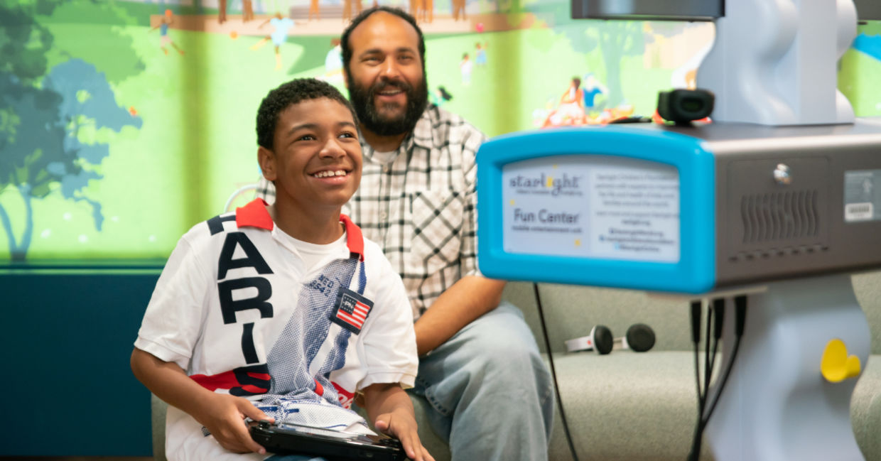 A boy in the hospital plays Nintendo. A boy in the hospital plays Nintendo.