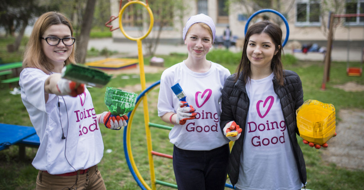 Volunteers sprucing up a playground. Volunteers sprucing up a playground.