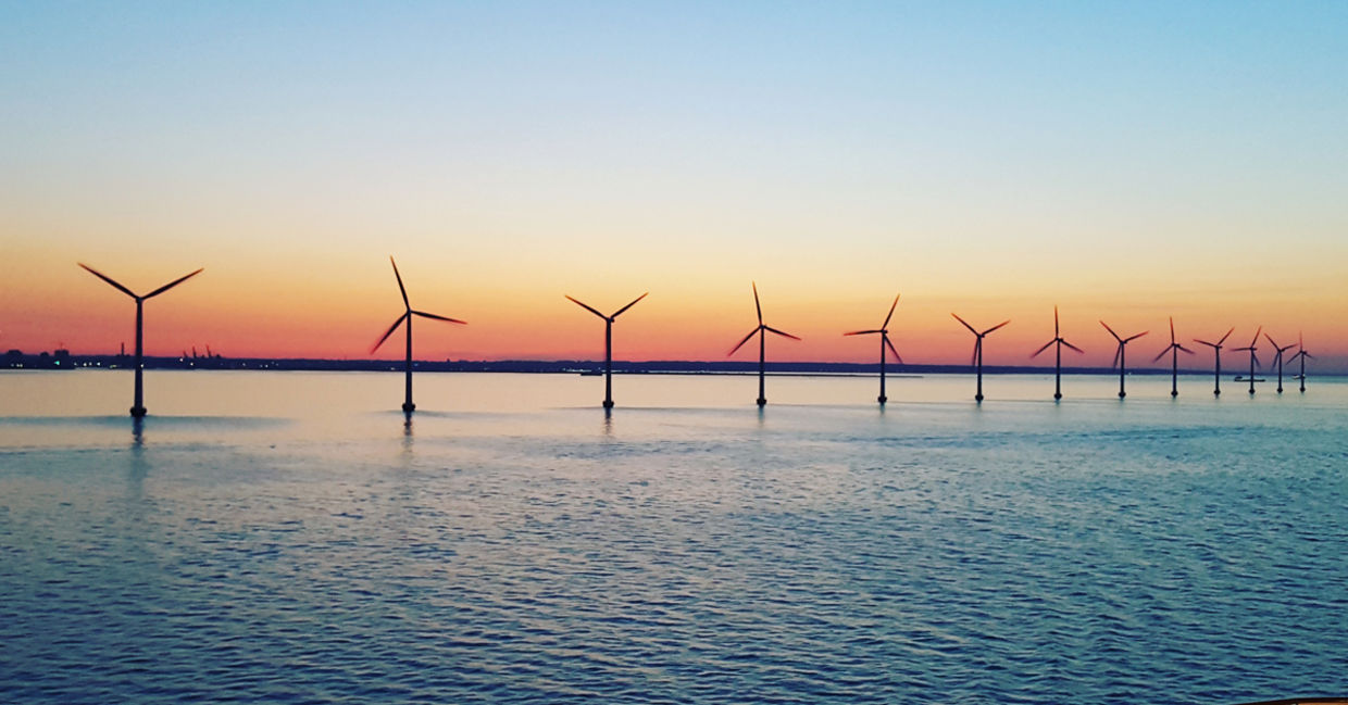 Windmills at sunset renewable energy Windmills at sunset renewable energy