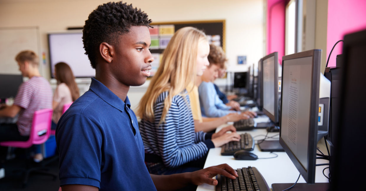 Teenagers learning coding. Teenagers learning coding.