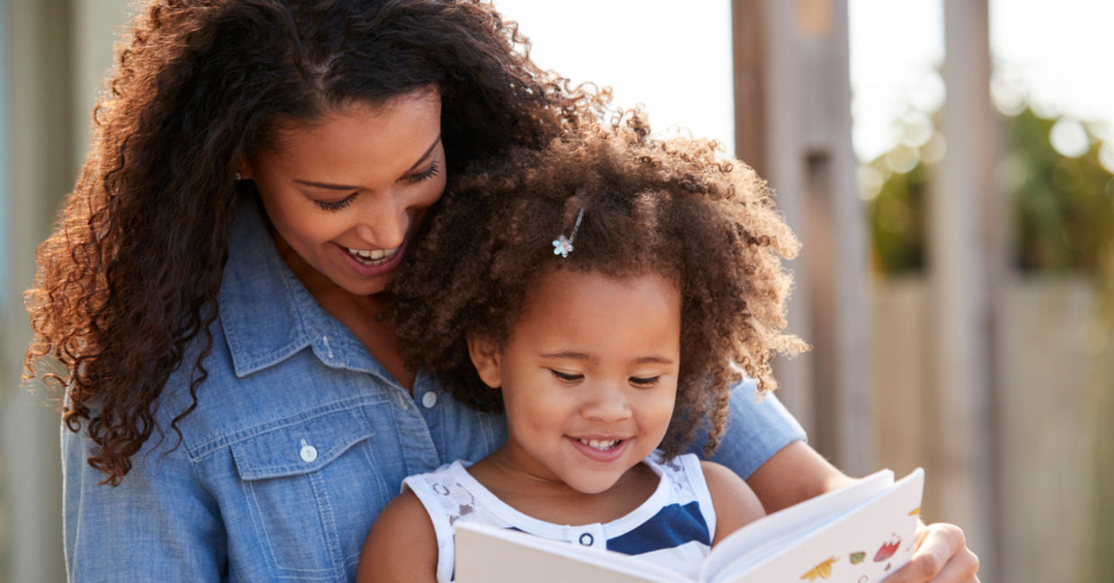Mother reading epic books for kids about women's history. Mother reading epic books for kids about women's history.