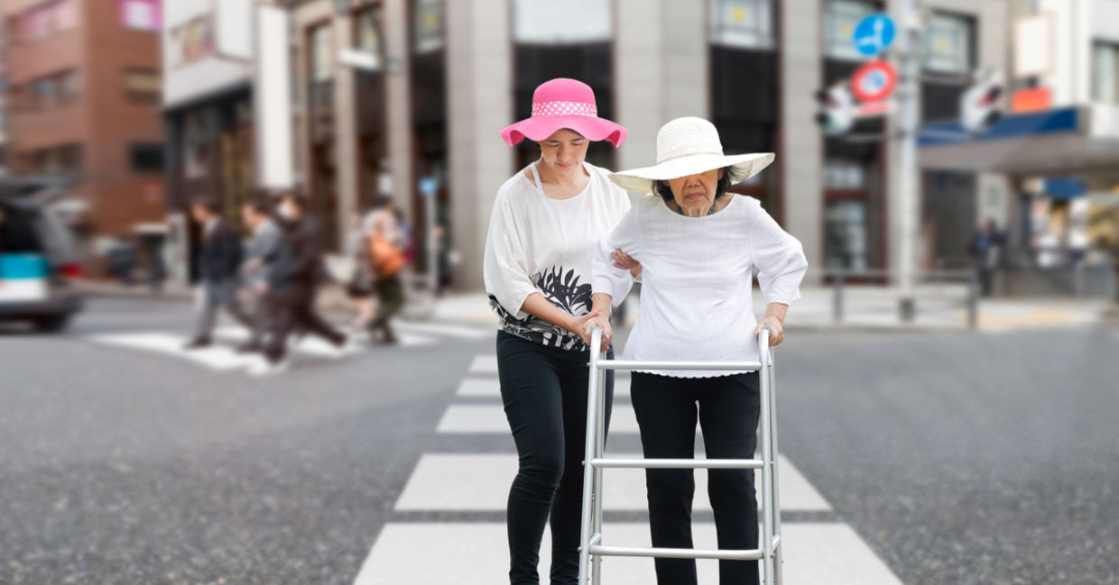 Helping an old woman across the road Helping an old woman across the road