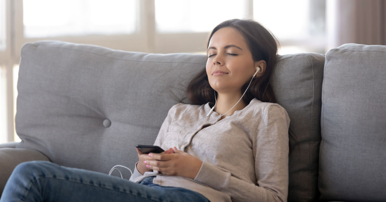 Woman listing to relaxing sleep music. Woman listing to relaxing sleep music.