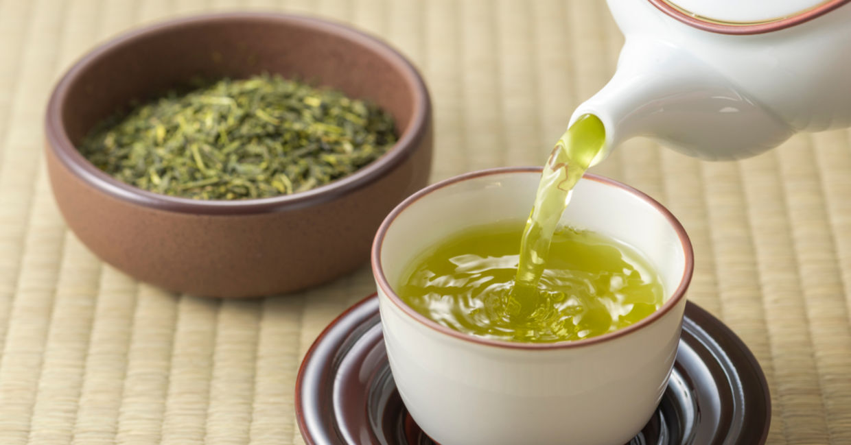 Pouring green tea Japanese style. Pouring green tea Japanese style.