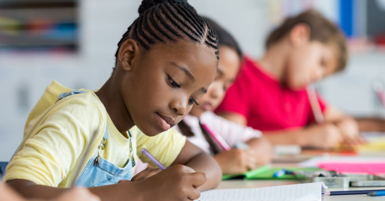 Pupils learning in a classroom
