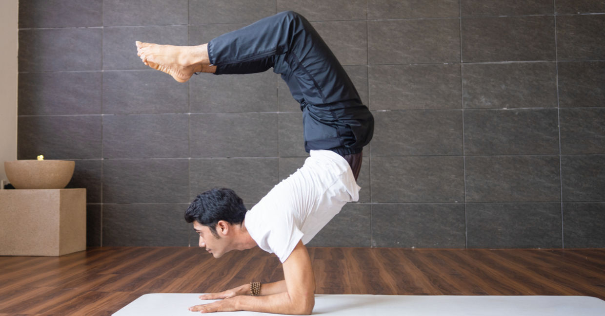Man in the scorpion pose. Man in the scorpion pose.