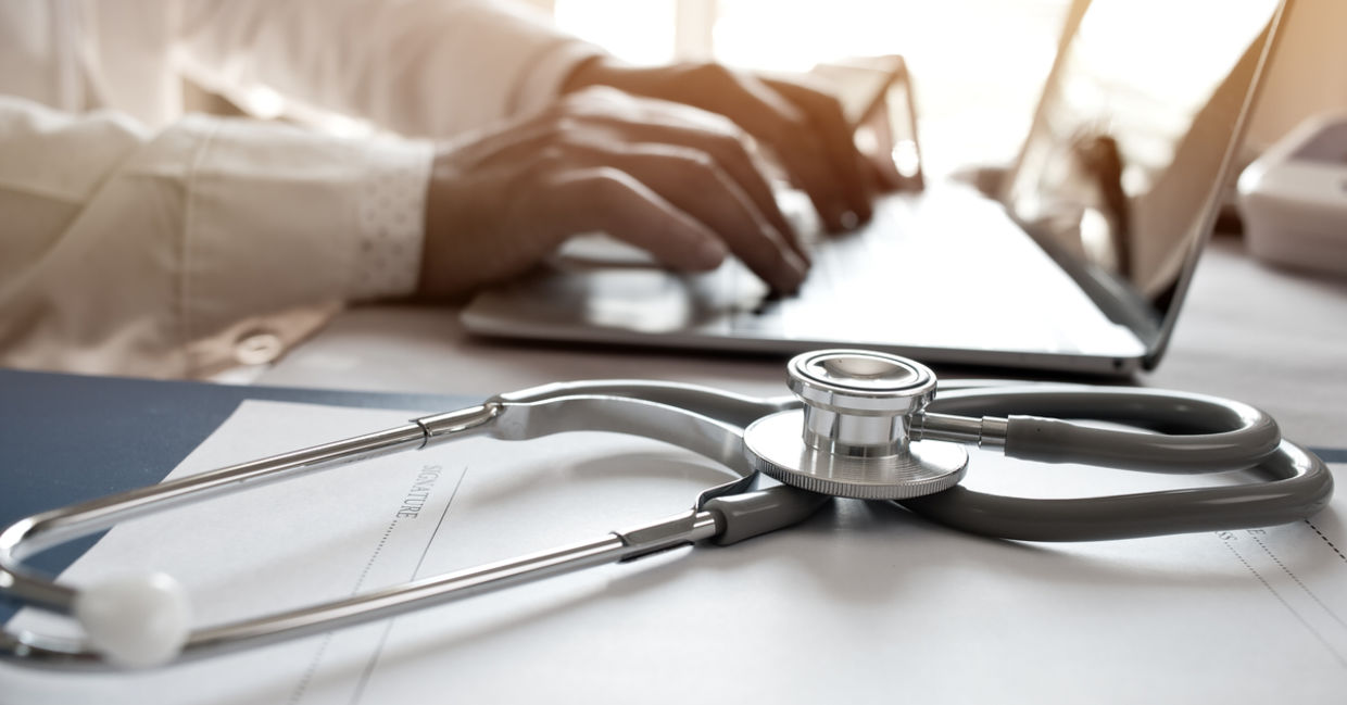 A stethoscope on a laptop A stethoscope on a laptop