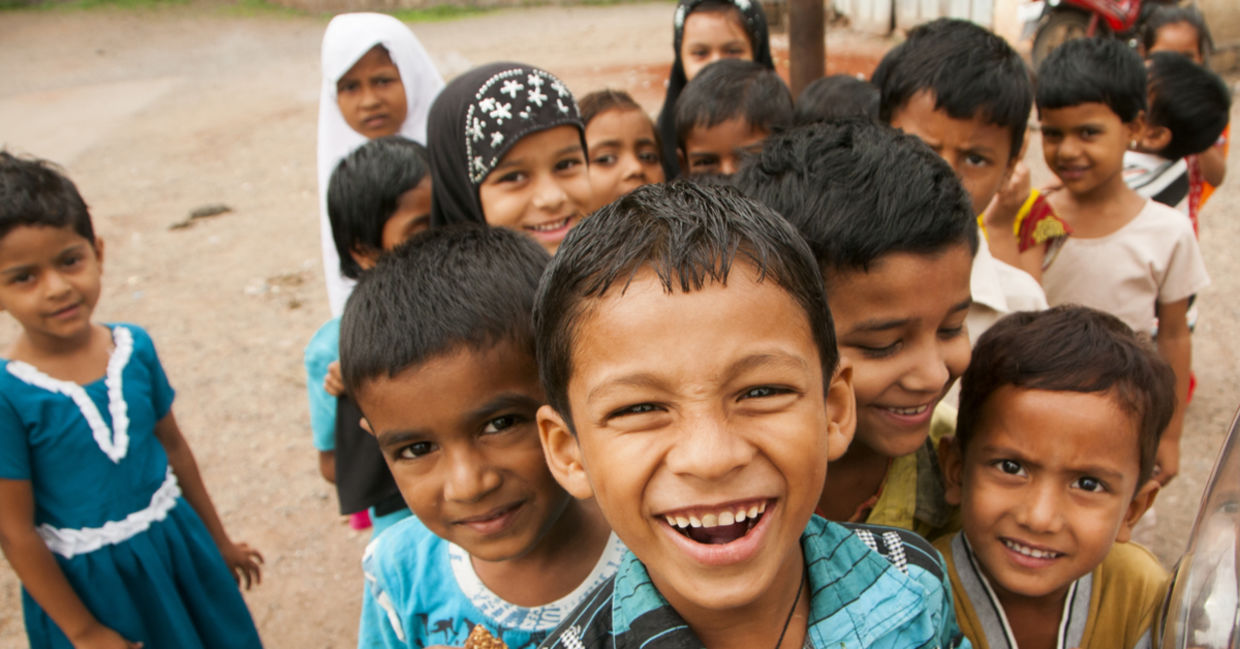 A group of smiling Indian children. A group of smiling Indian children.